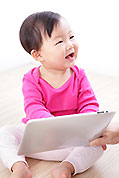 young child looking at ipad