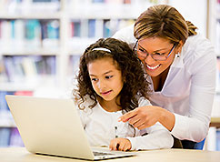 Teacher encouraging young student