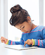 young girl looking at ipad
